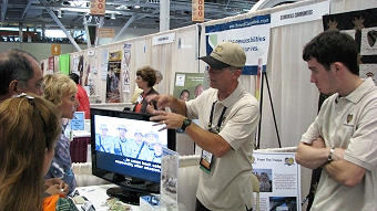 Marty and Brian Horn talking to the folks at the booth.